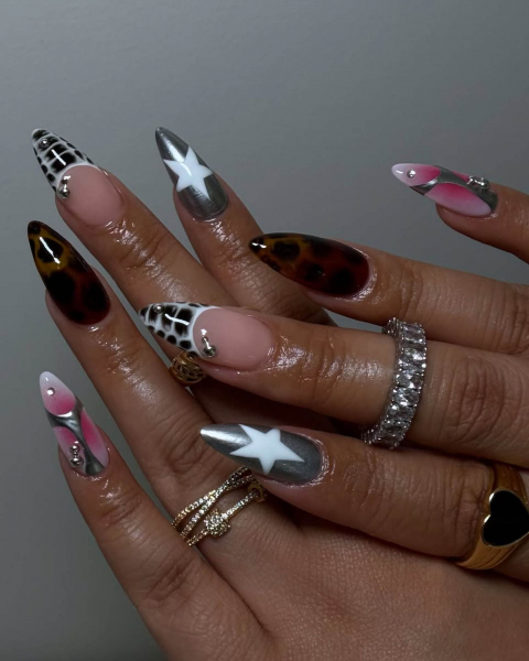 Layered hands showing assorted nails pink and white with silver details cheetah print snakeprint French tip and silver...
