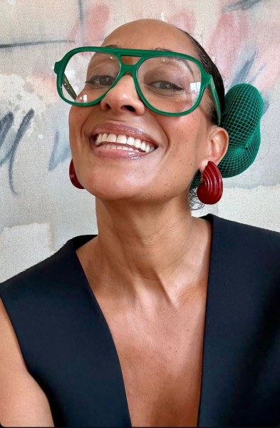 Image may contain Tracee Ellis Ross Body Part Face Head Neck Person Adult Happy Smile Accessories and Glasses