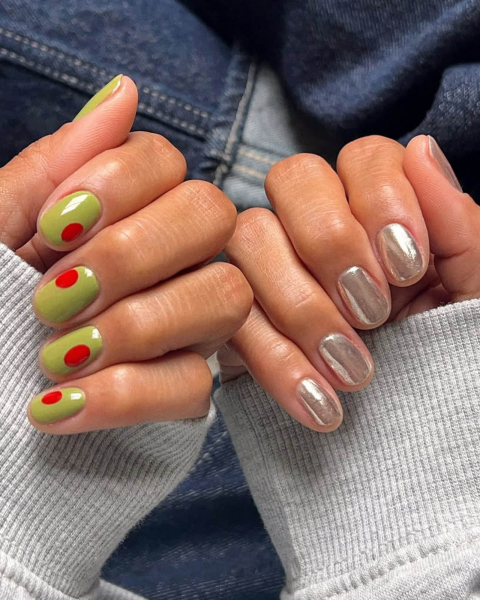 Two hands with nails curled upwards showing on the left olivestyled nails and metallic light gold nails on the right.
