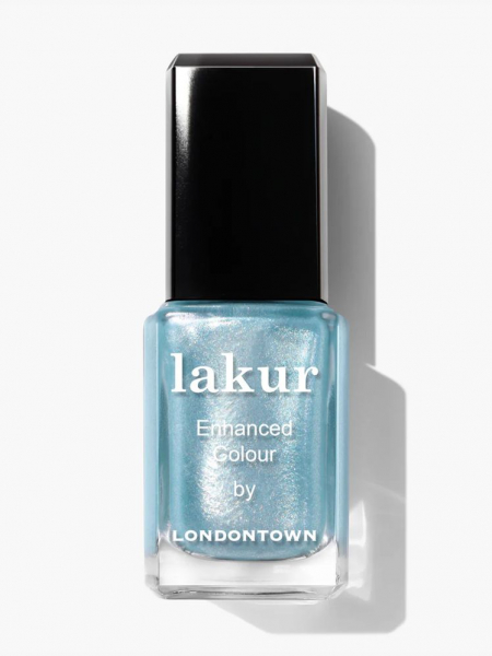 Clear nail polish bottle with light blue metallic polish and a black top. 